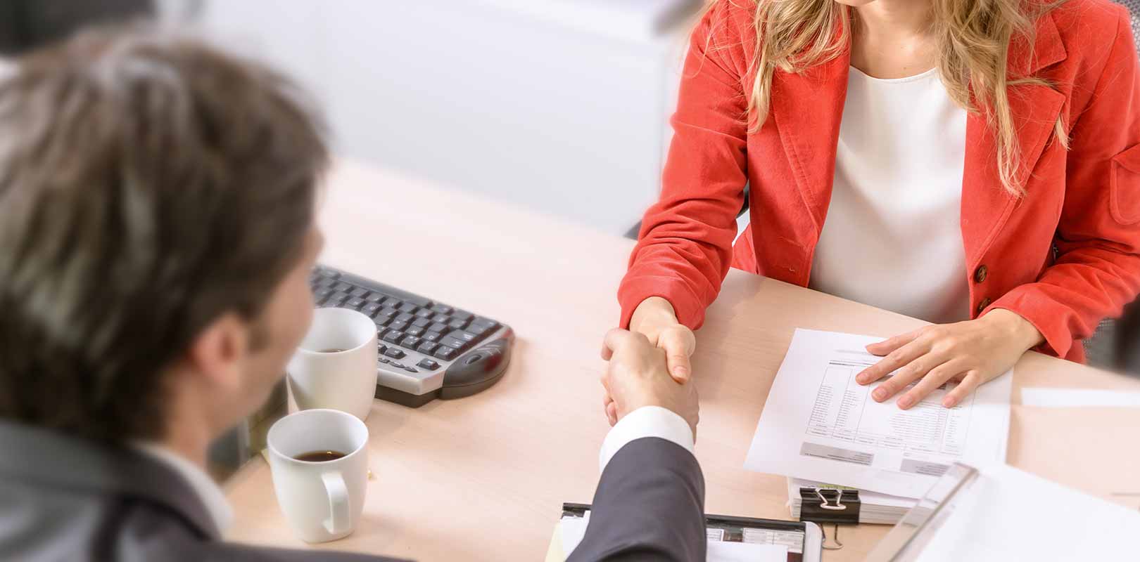 Sales woman agreeing a design contract with client