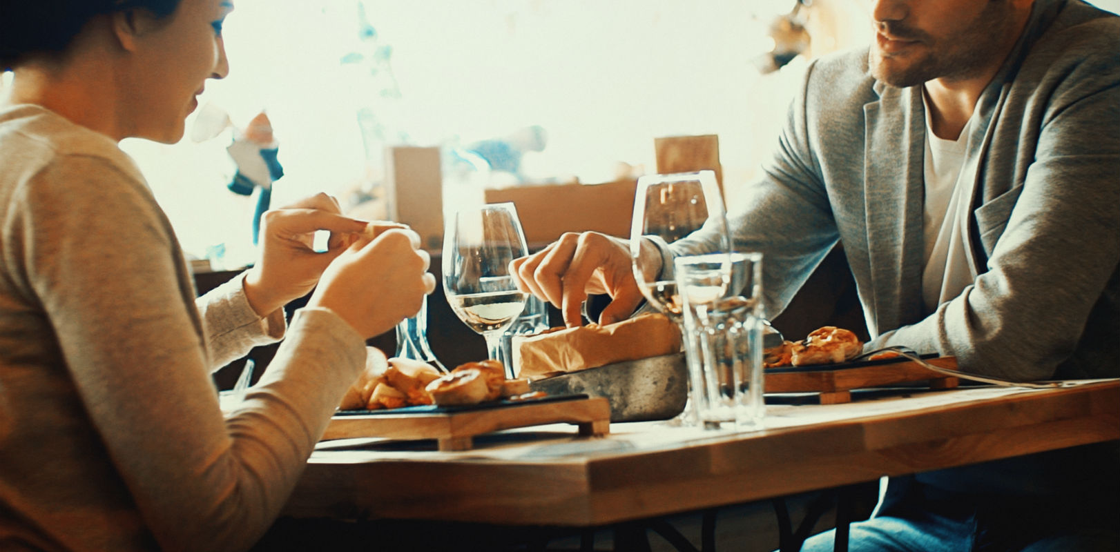 People enjoying food and drink in a restaurant