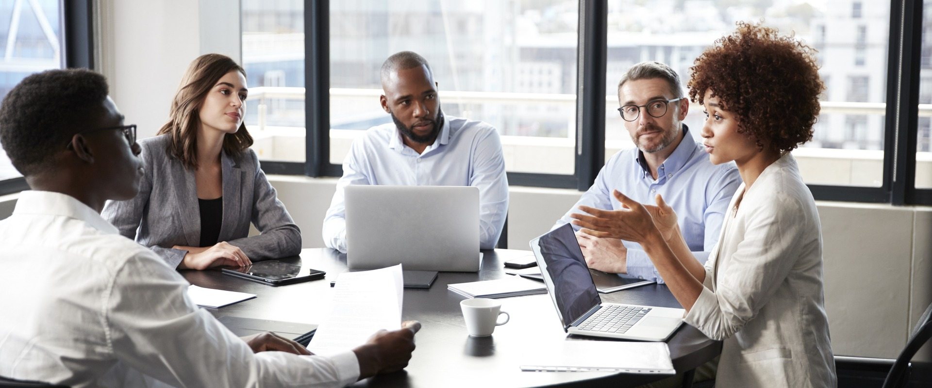 Professional business people having a meeting around a table